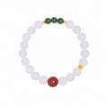 White background view of cinnabar and chalcedony bracelet with green jade beads