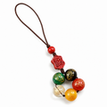 Cinnabar five-element agate phone charm on clean white background