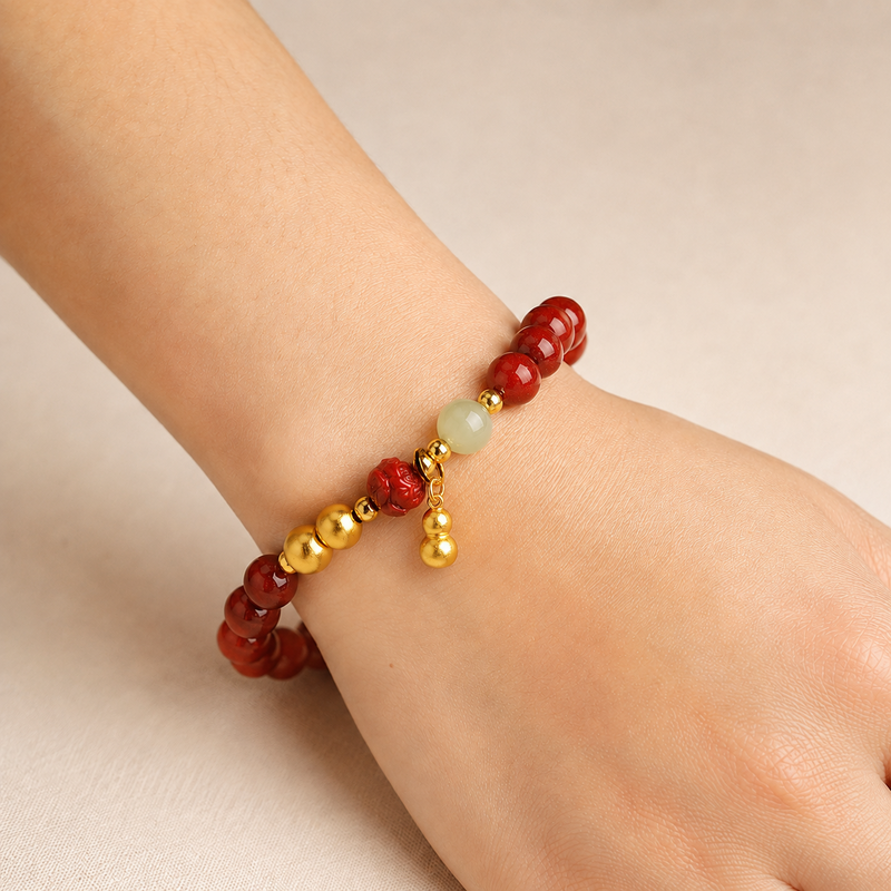 Woman wearing a cinnabar lotus jade bead bracelet