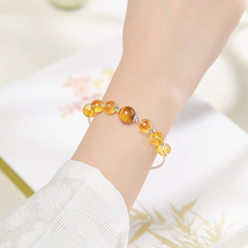 Second wrist view of citrine and tiger's eye bracelet