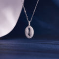 S925 silver coffee bean necklace on dark navy background