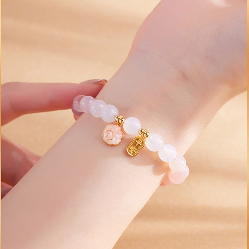 Gradient crimson agate bracelet shown from an alternate wrist angle