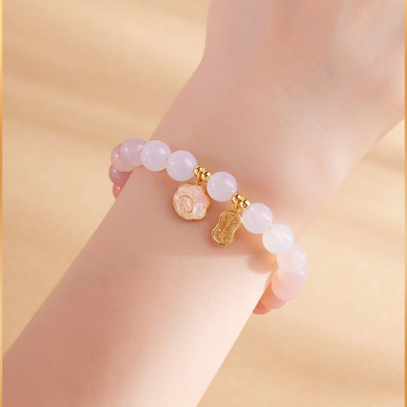 Cat paw and peace plaque bracelet wrist detail