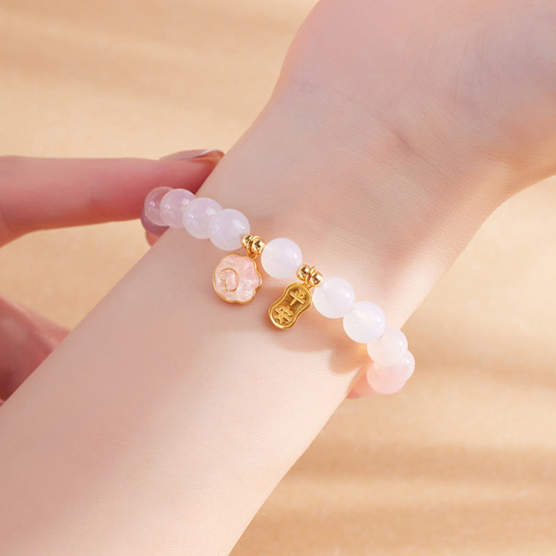 Crimson agate cat paw bracelet worn on wrist