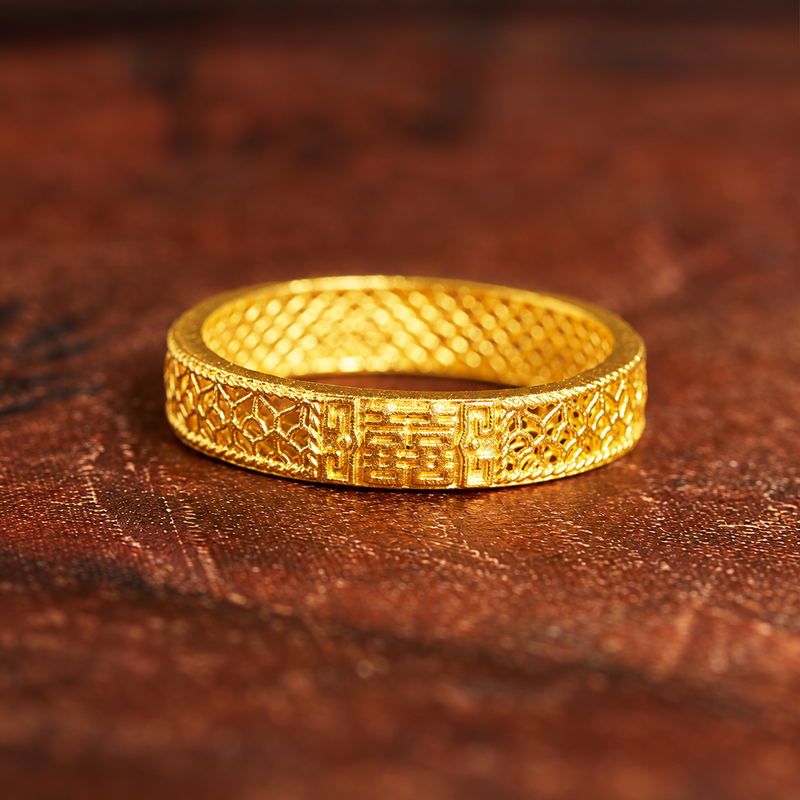 Double Happiness filigree ring on a warm wooden background