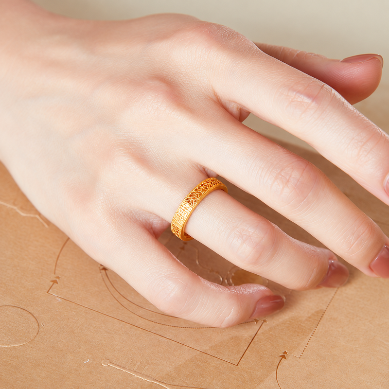 Original model wearing the ring with hand resting on paper