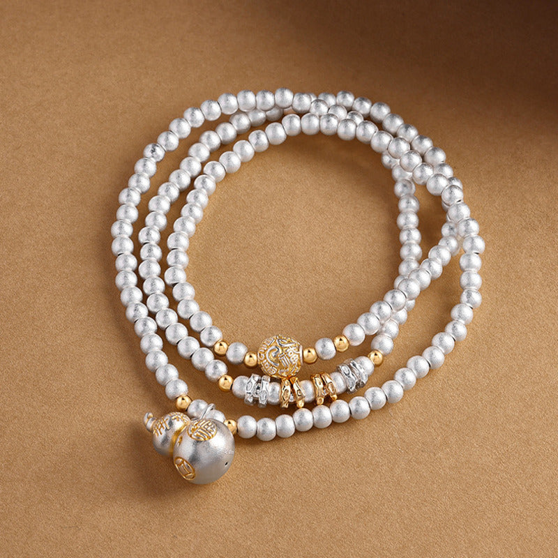 999 fine silver gourd multi-wrap bracelet on sand