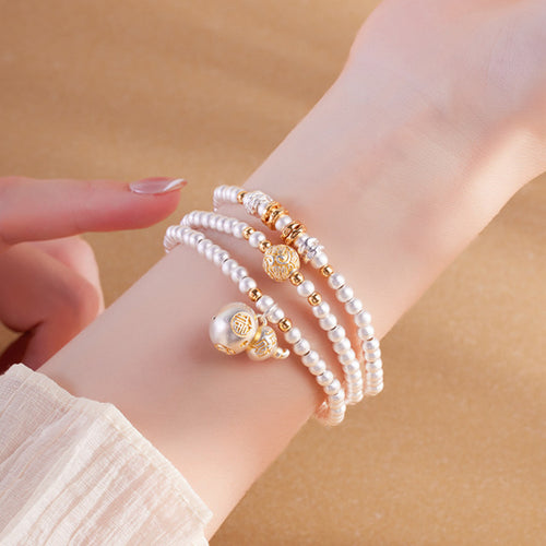 Model wearing 999 fine silver gourd multi-wrap bracelet