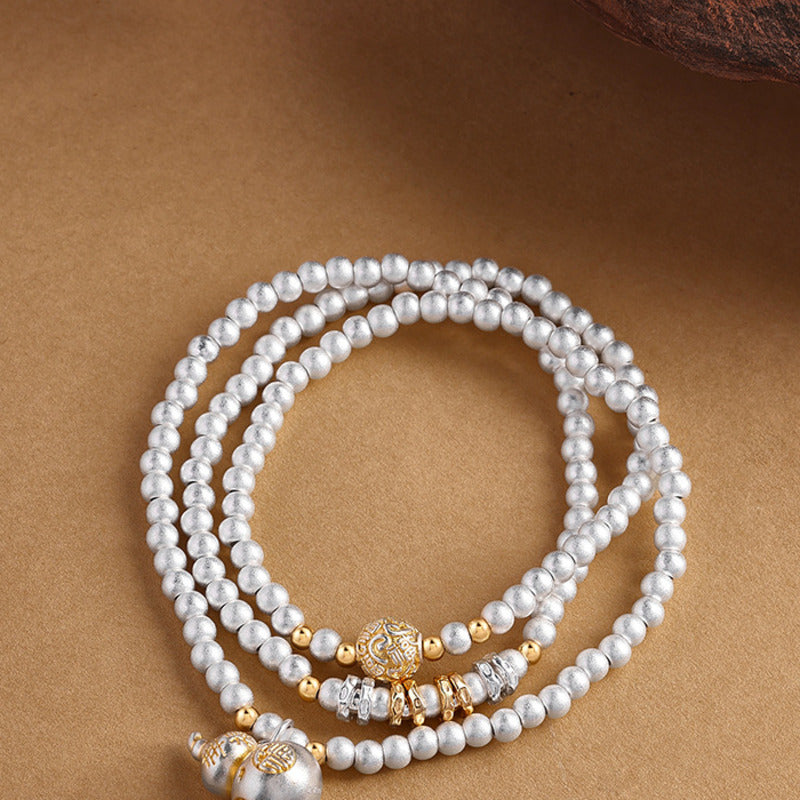 999 fine silver gourd bracelet detail on sand