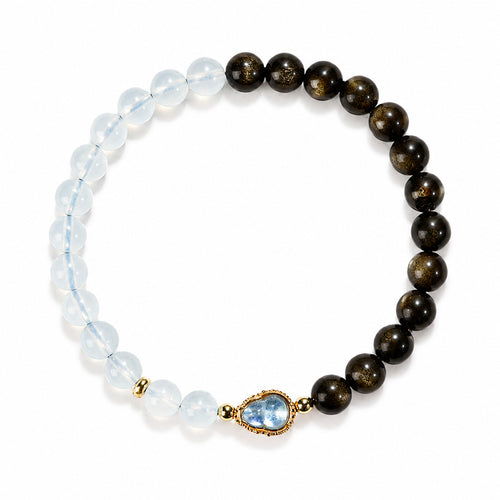Gold obsidian and aquamarine blue crystal gourd bracelet on white background