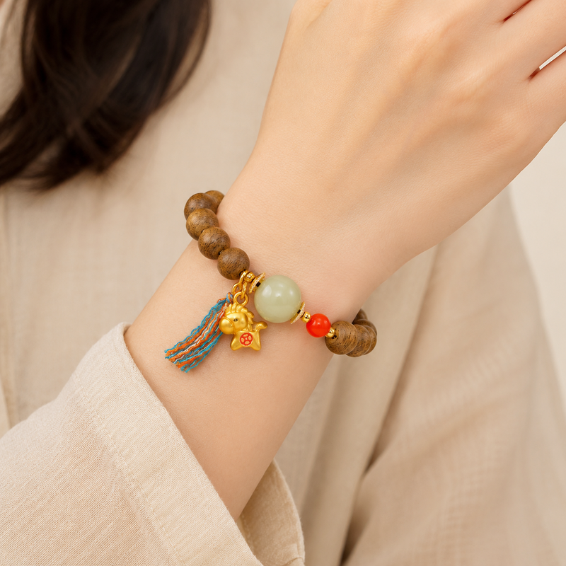 Gold-tone lucky horse Qinan agarwood bracelet worn on wrist
