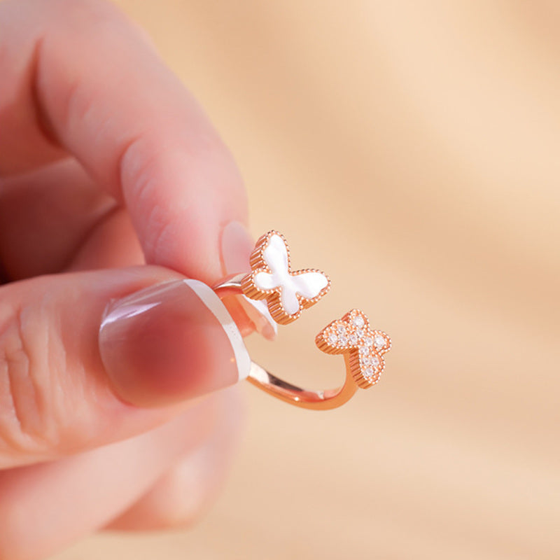Open butterfly ring held to show front design