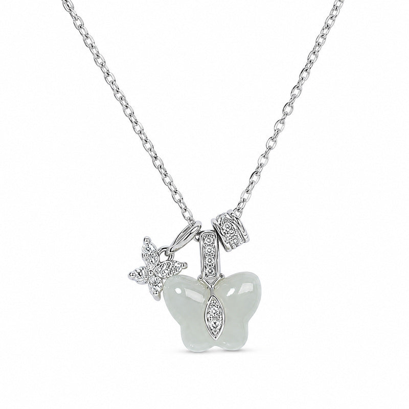 Greenish-white jade butterfly necklace on a clean white background