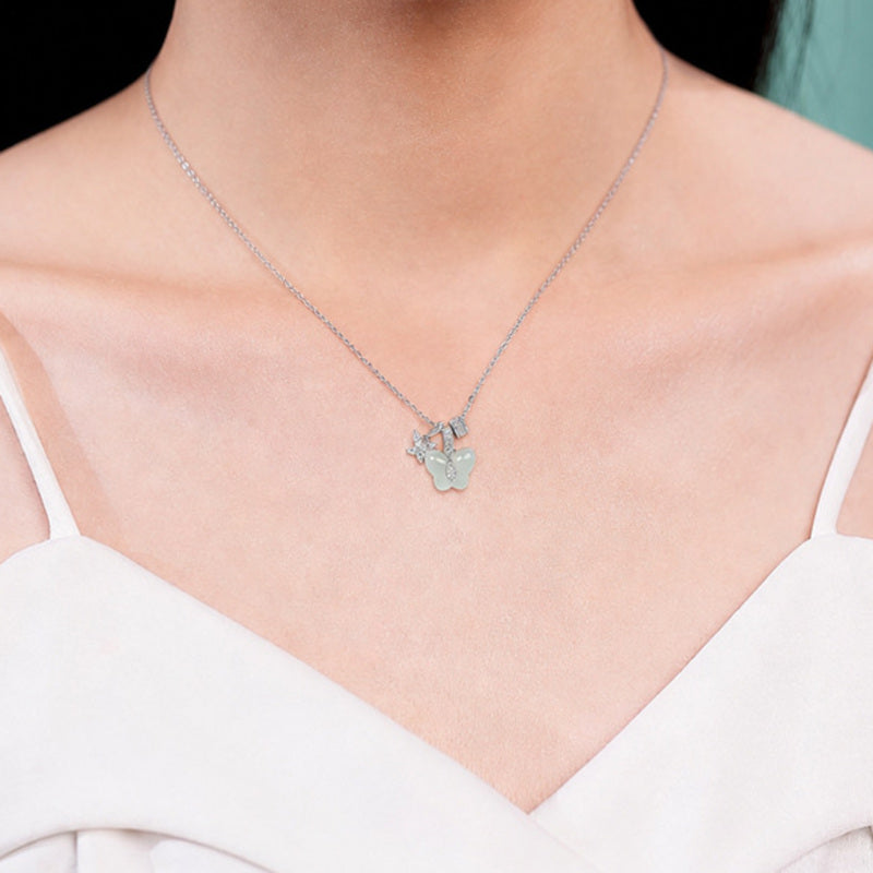 Model wearing the greenish-white jade butterfly necklace