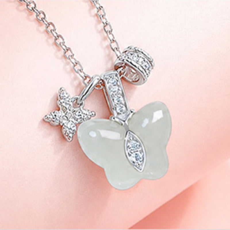 Close view of the jade butterfly and zircon-set silver details
