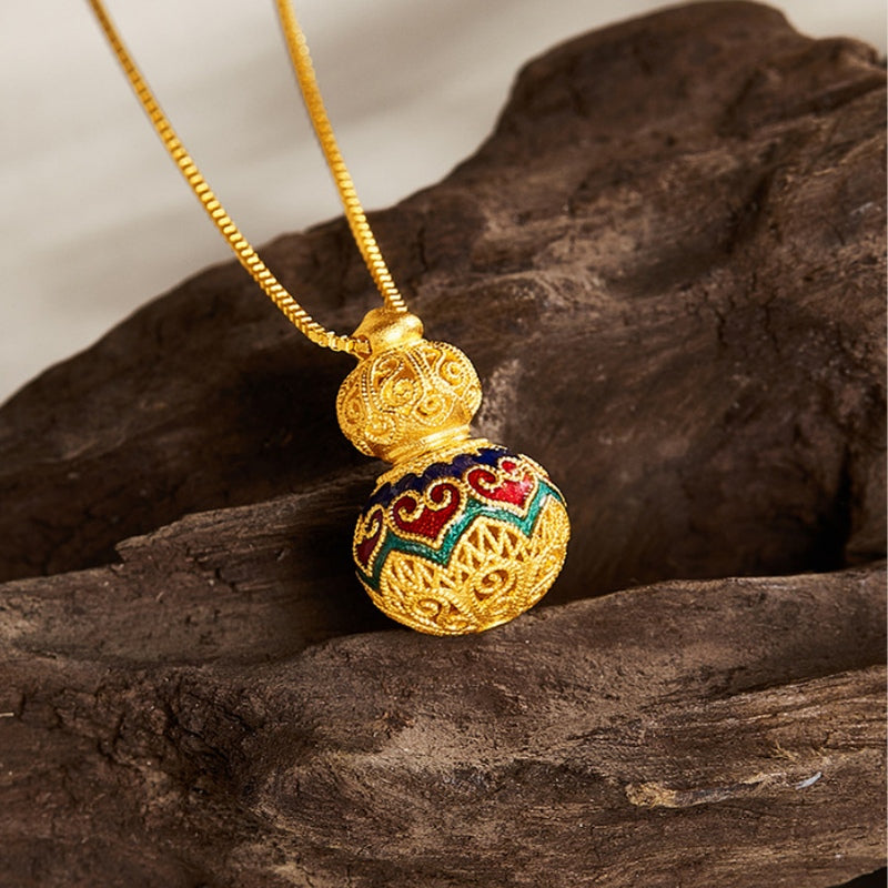 Traditional filigree and colorful heart enamel pendant on wood