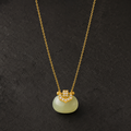 Hetian jade blessing pouch necklace on dark background