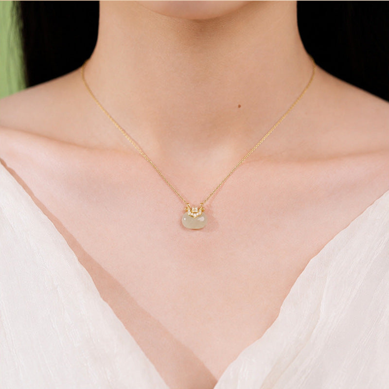 Model wearing Hetian jade blessing pouch necklace