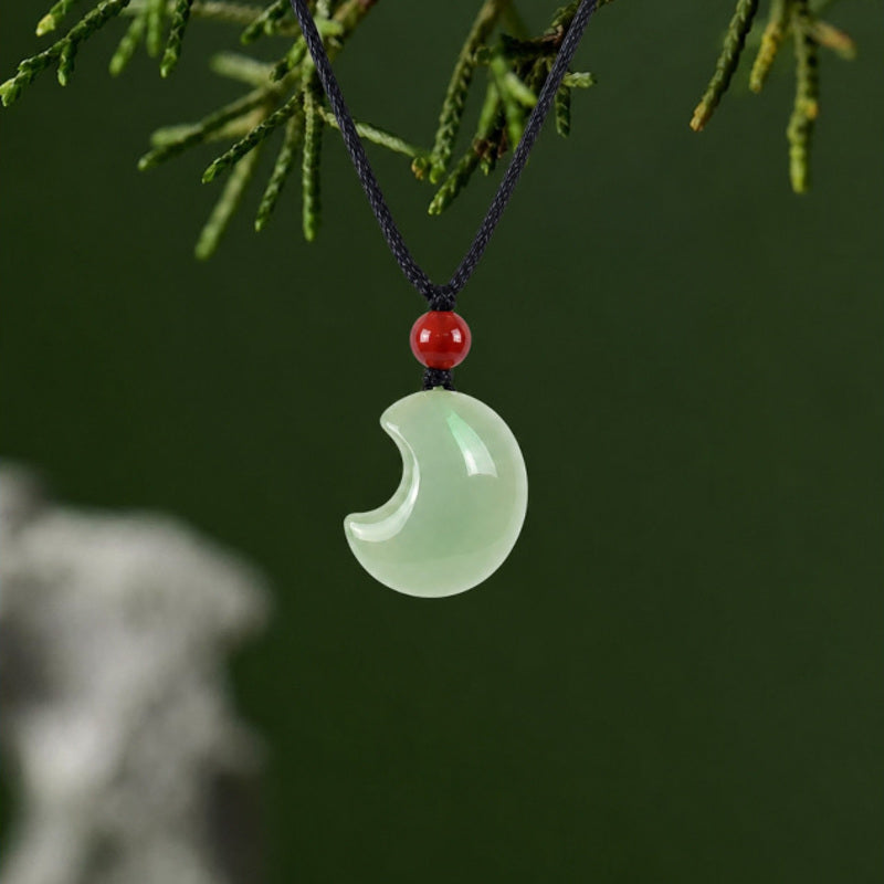 Hetian jade crescent moon necklace with red carnelian on black cord
