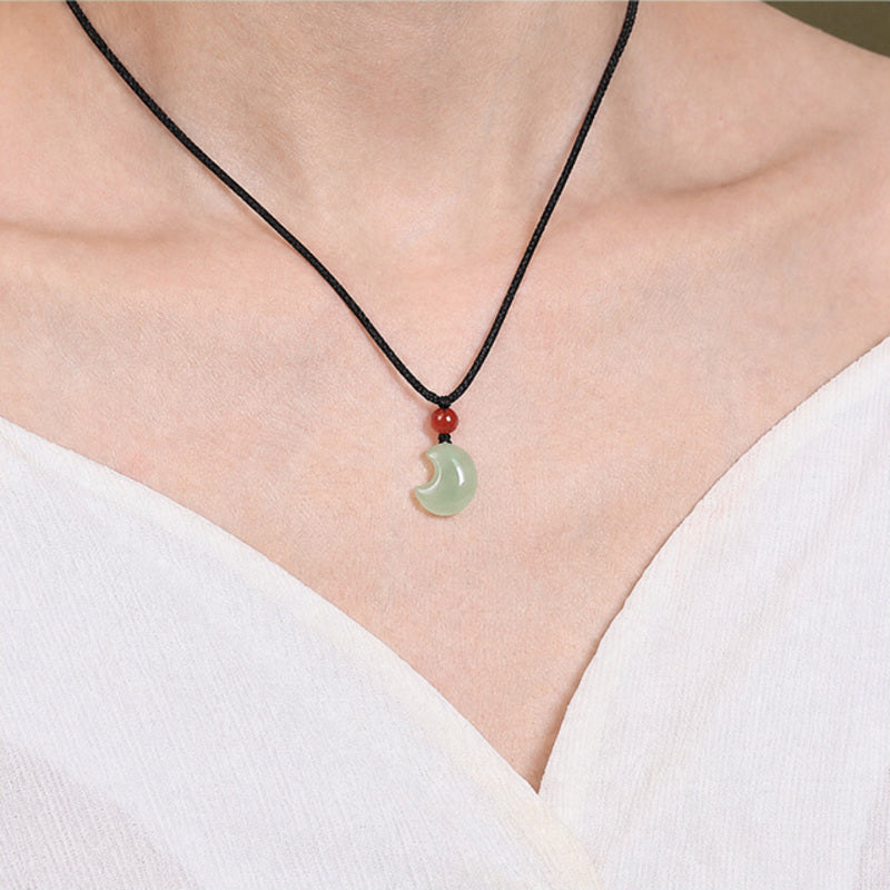 Model wearing Hetian jade crescent moon necklace