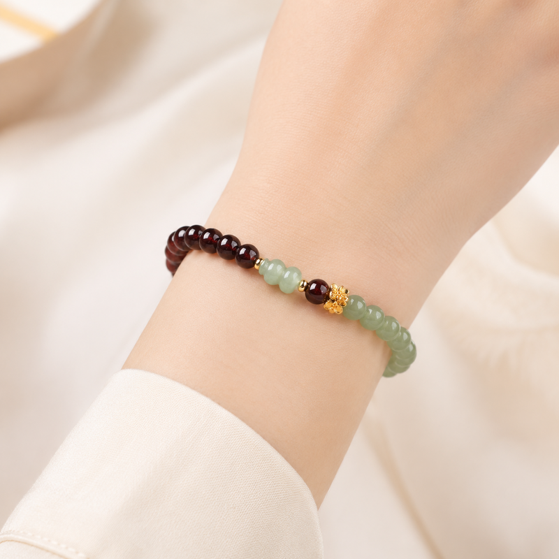 Model wearing Hetian jade gourd and dark red garnet bracelet