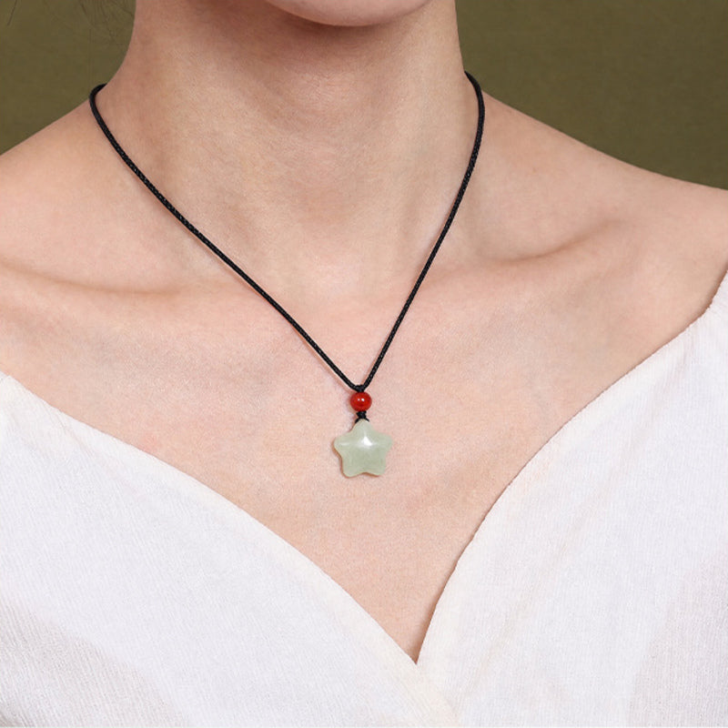 Model wearing the Hetian jade star necklace with red agate