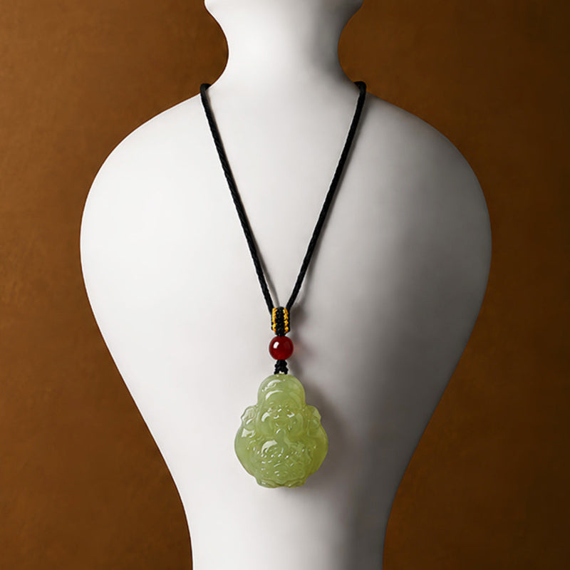 Hetian jade Wealth God pendant necklace displayed on a jewelry bust