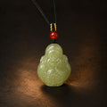 Hetian jade Wealth God pendant necklace on a dark studio background