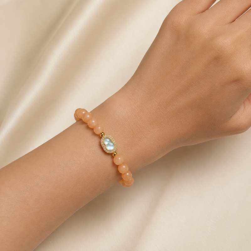 Ice Jade Gourd Sunstone Bracelet worn on a woman's wrist