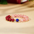 Lapis lazuli and red pink beaded bracelet on warm background