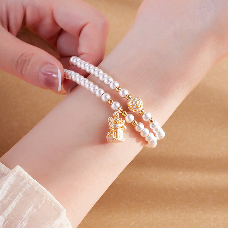 Model adjusting the elastic lion dance double-wrap bracelet