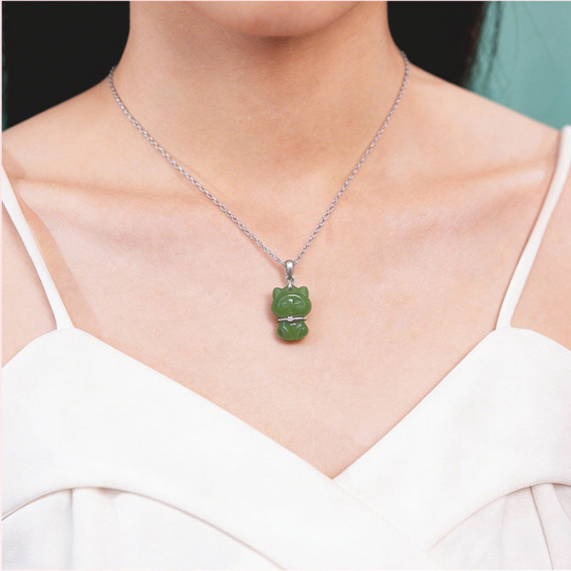 Model wearing nephrite jade lucky cat necklace