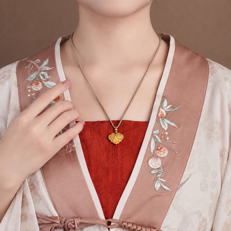 Supplier model wearing the magpie and plum lock necklace, front view