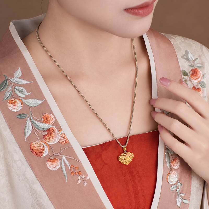 Supplier model wearing the lock necklace, three-quarter view