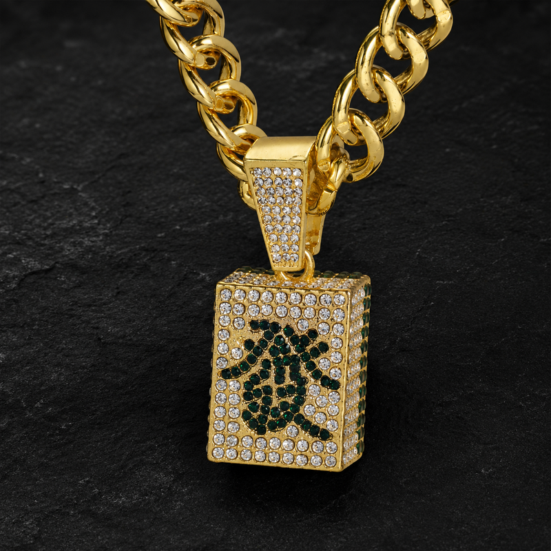 Gold pavé Mahjong wealth tile pendant on a dark background