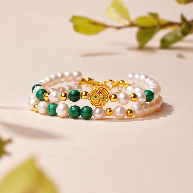 Malachite and freshwater pearl double-strand bracelet on a natural background