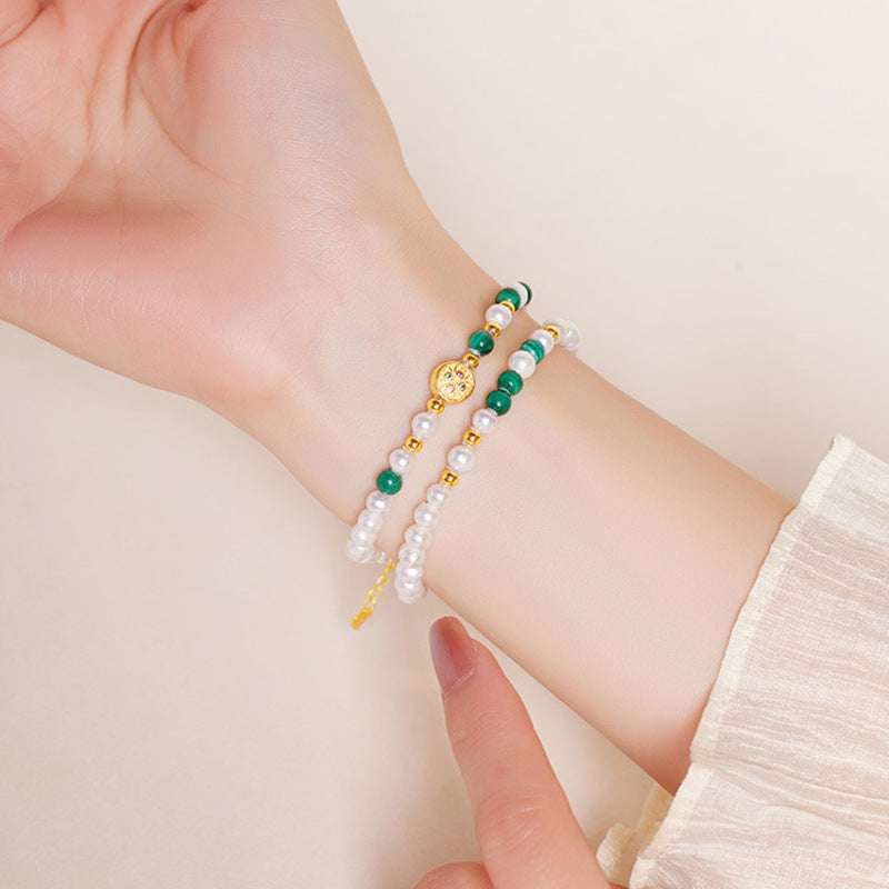 Original model wearing the malachite and freshwater pearl bracelet