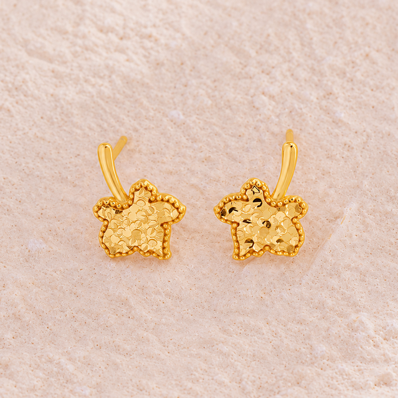 Front view of textured maple leaf stud earring pair