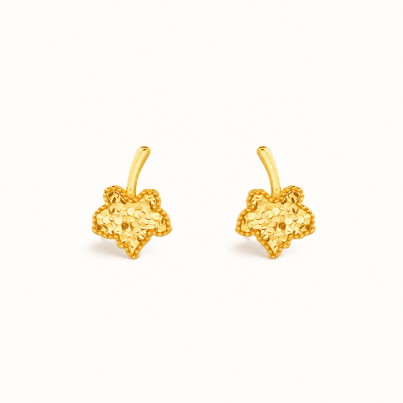 Maple leaf stud earring pair on white background