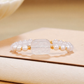 White chalcedony and freshwater pearl bracelet on warm ivory display