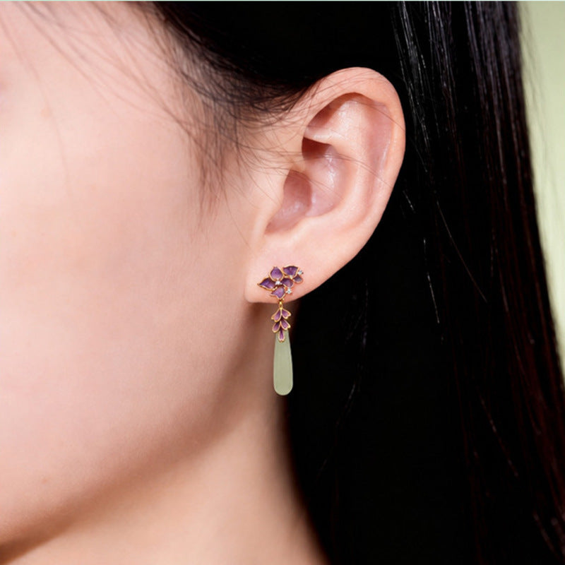 Model wearing natural jade iris drop earring