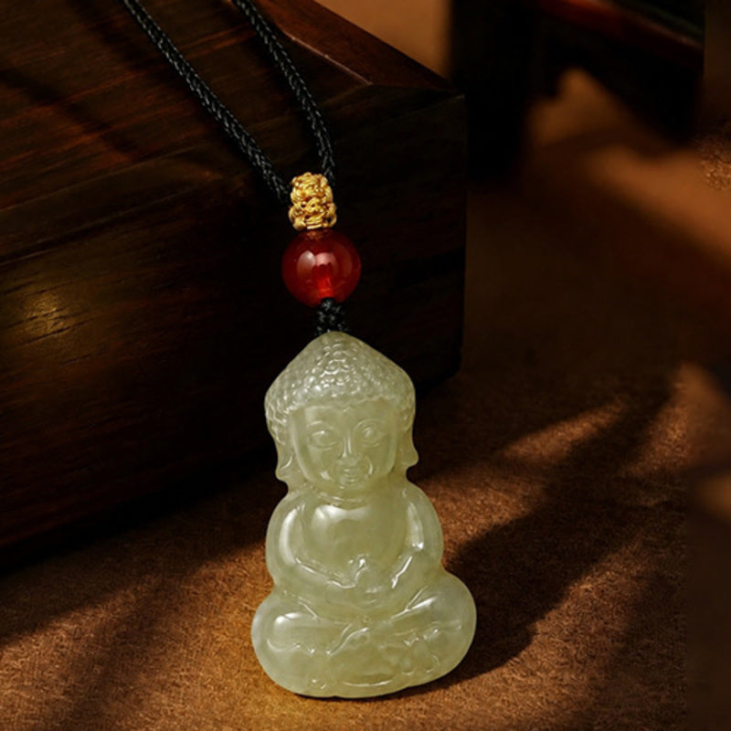 Close view of the nephrite jade Buddha carving and red agate accent