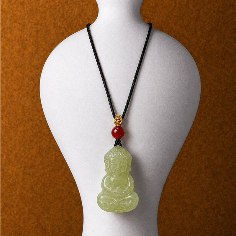Nephrite jade Buddha pendant displayed on a necklace bust