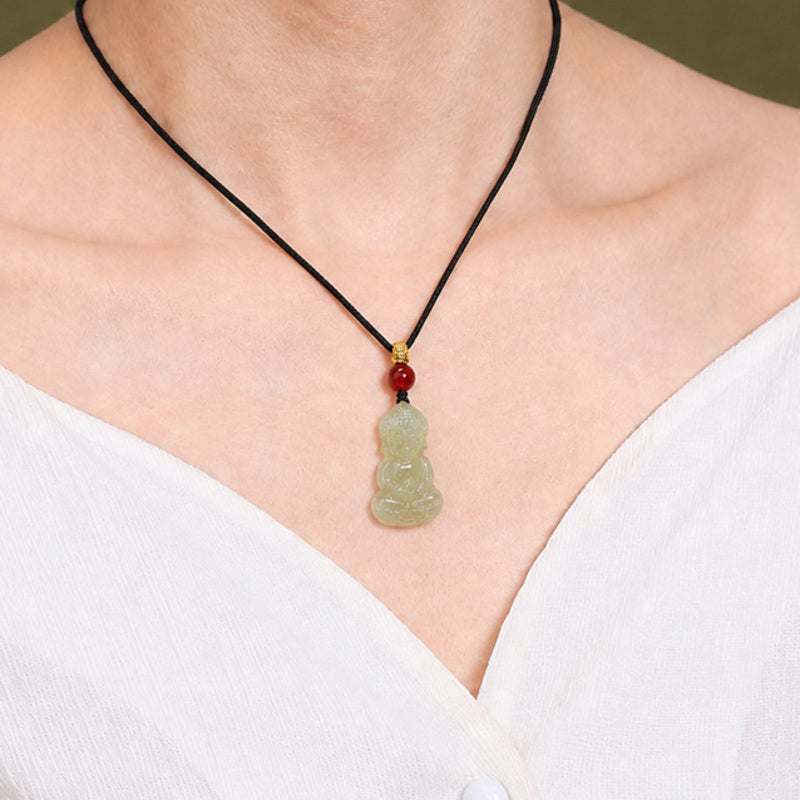 Model wearing a nephrite jade Buddha pendant