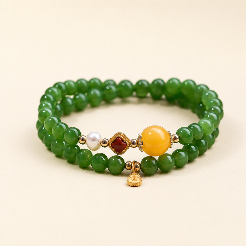 Green nephrite jade double-wrap bracelet in warm ivory studio view