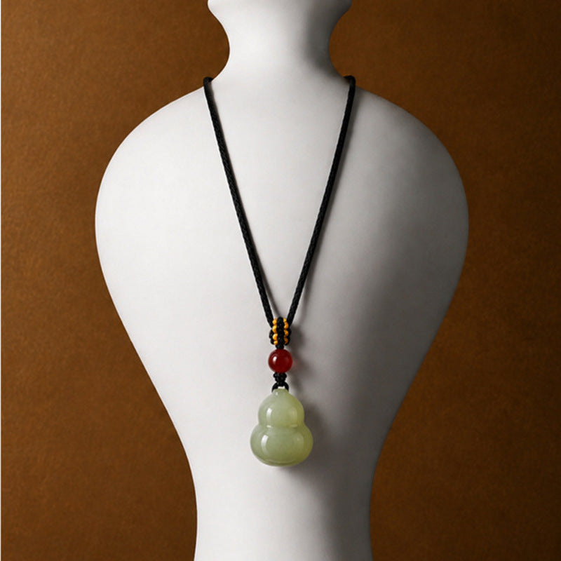 Full-length nephrite jade gourd necklace display