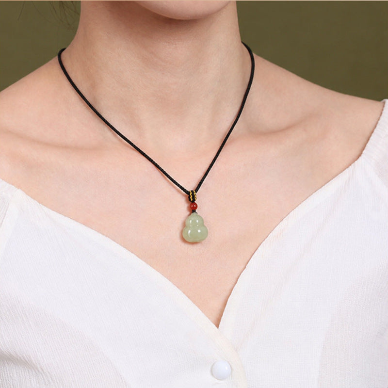 Model wearing nephrite jade gourd necklace