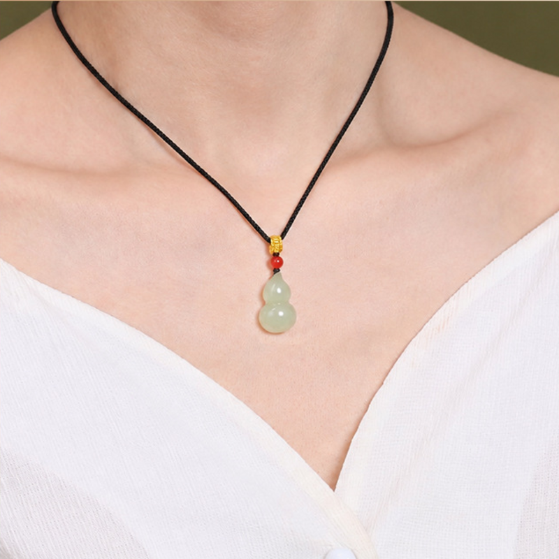 Nephrite jade gourd pendant worn on model