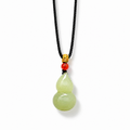Nephrite jade gourd pendant with complete braided cord and soft shadow on white background
