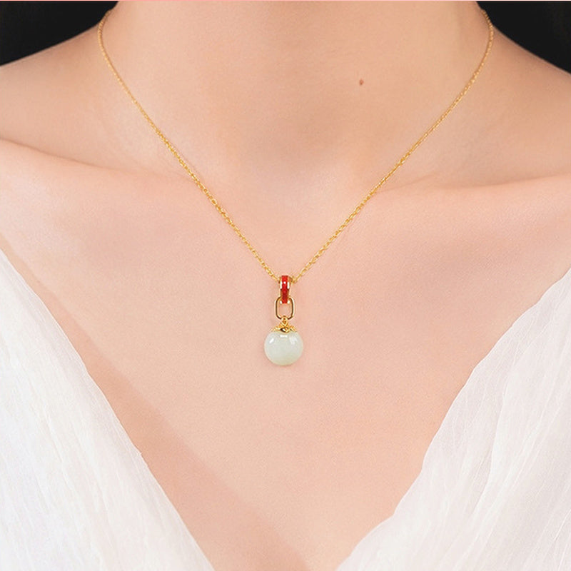 Model wearing nephrite jade lucky coin necklace